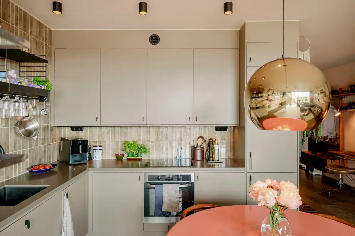 A Modern Swedish Apartment with Half-Painted Pink Walls 10 modern kitchen detail