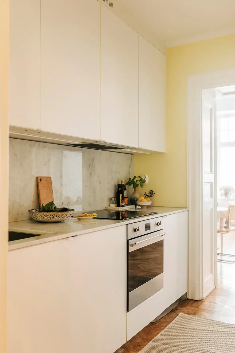 A Farrow & Ball Palette in an Art Nouveau Stockholm Apartment 15 modern white kitchen pale yellow wall nordroom