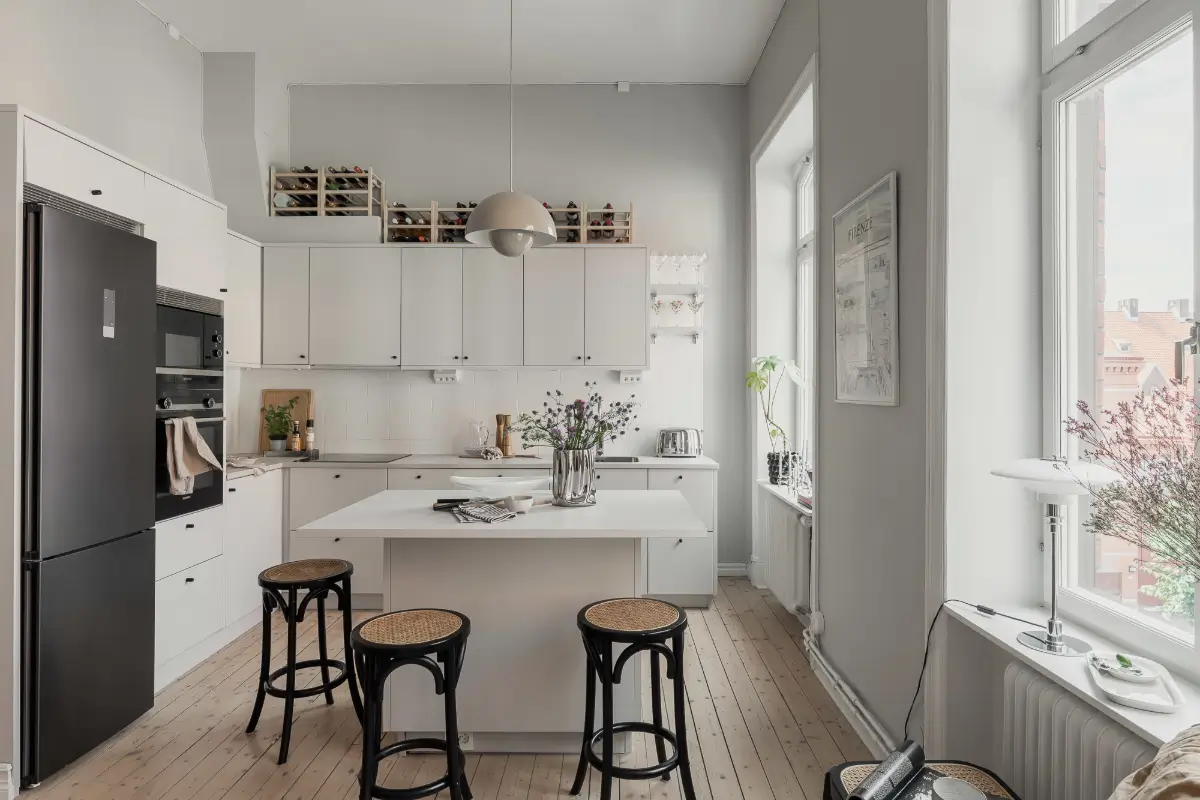 A Gray Scandinavian Apartment with a Royal History 10 modern white kitchen with island