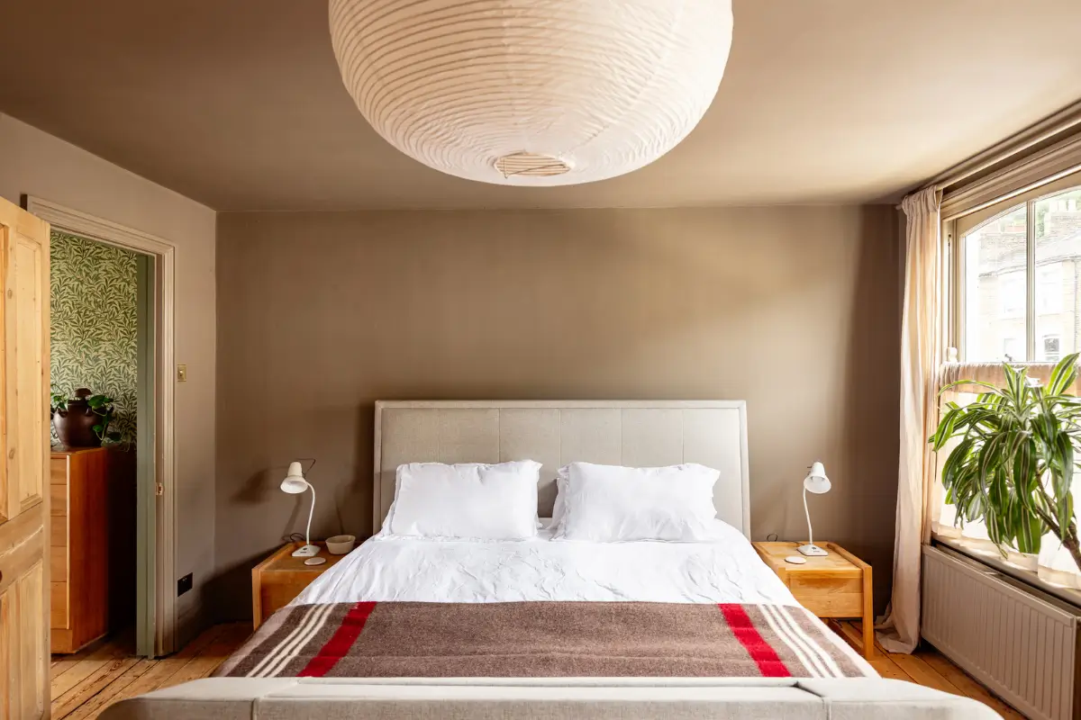 A Muted Color Palette and Original Details in a Victorian Terrace House 16 neutral colored bedroom