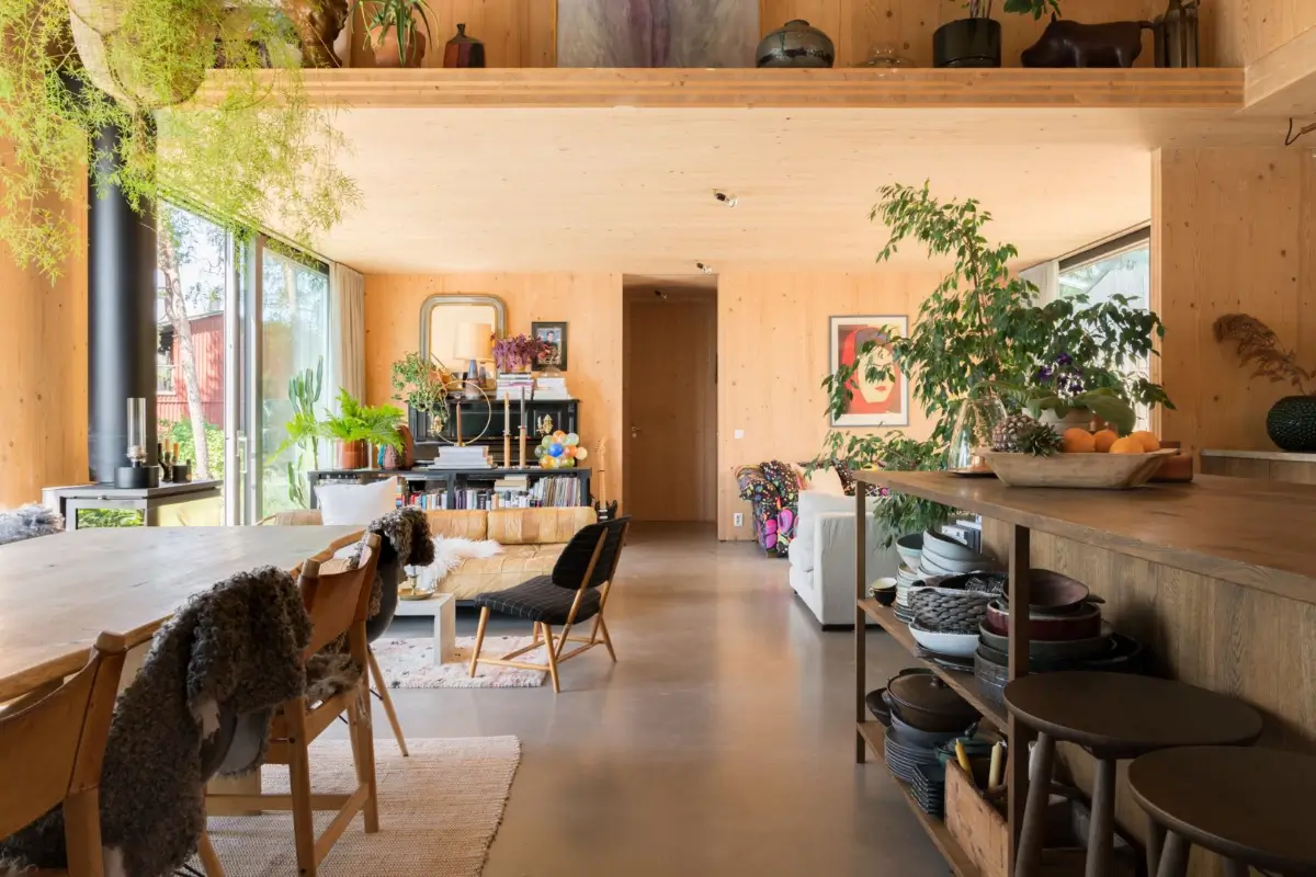 A Modern Wooden Cottage with Sea Views Close to Stockholm 7 open plan living space concrete floor wooden walls ceiling