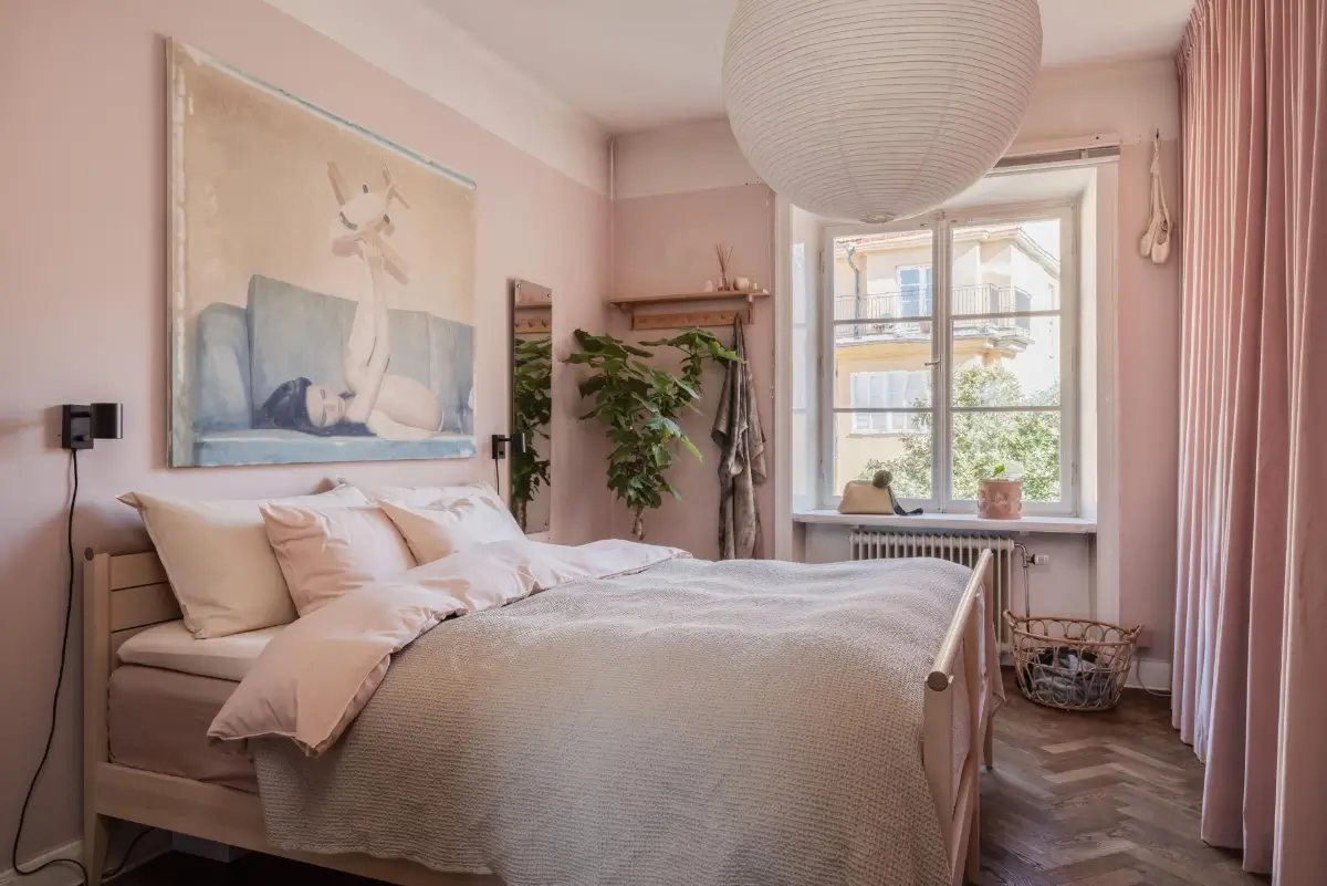 Colorful Rooms in a Practical Stockholm Family Apartment 12 pink bedroom floor to ceiling curtains hiding wardrobes