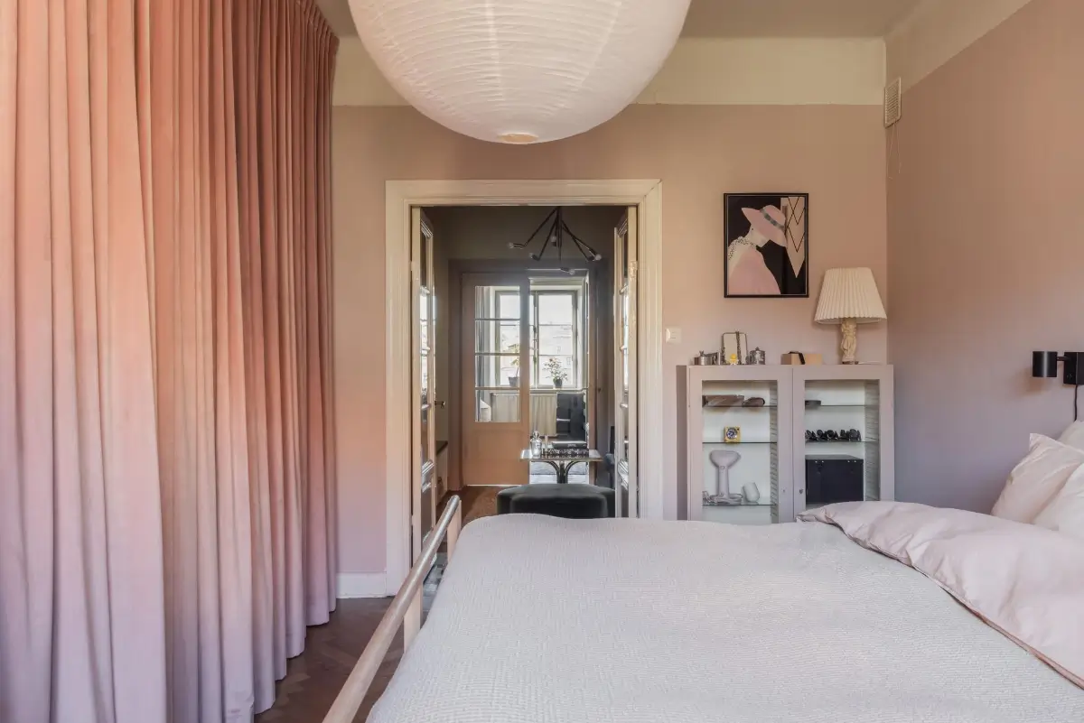 Colorful Rooms in a Practical Stockholm Family Apartment 14 pink bedroom wardrobes behind curtains
