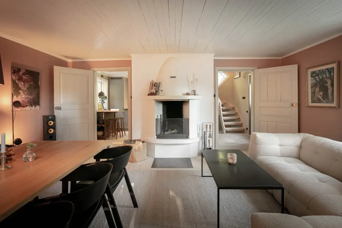 Modern Comforts and Historic Architecture in an 18th Century Home 9 pink living room with fireplace