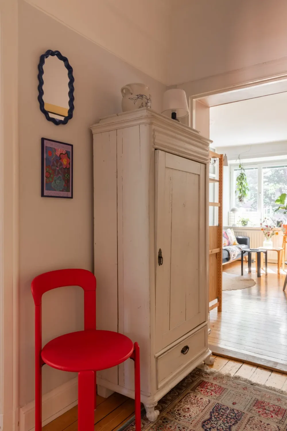 A Cozy Colorful Family Apartment with an Industrial Room Divider 10 red accent chair