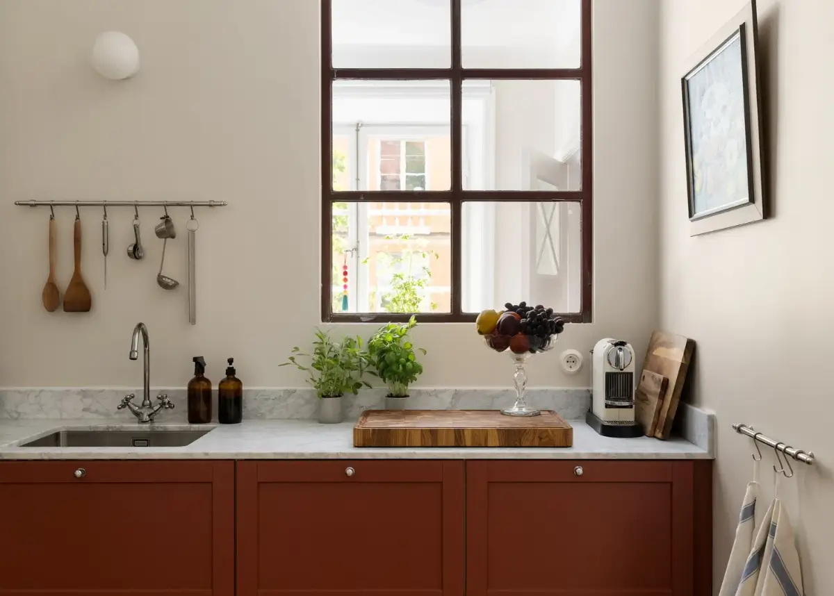 A Red Kitchen in a Small and Light Scandinavian Apartment 3 red and marble kitchen