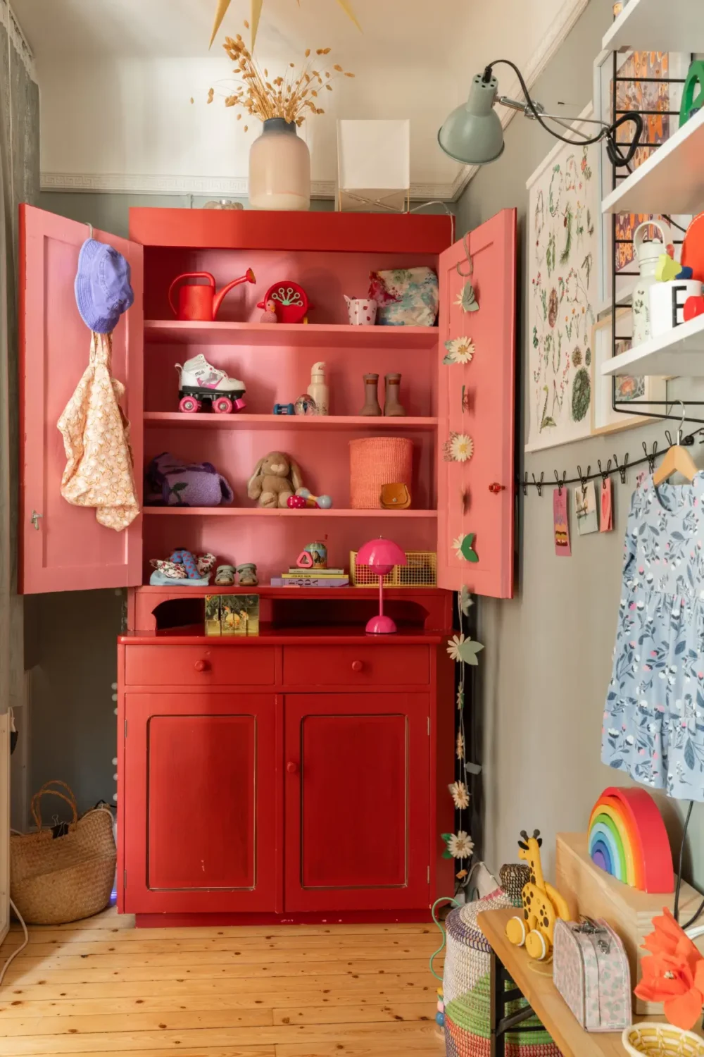 A Cozy Colorful Family Apartment with an Industrial Room Divider 8 red and pink cabinet kids bedroom