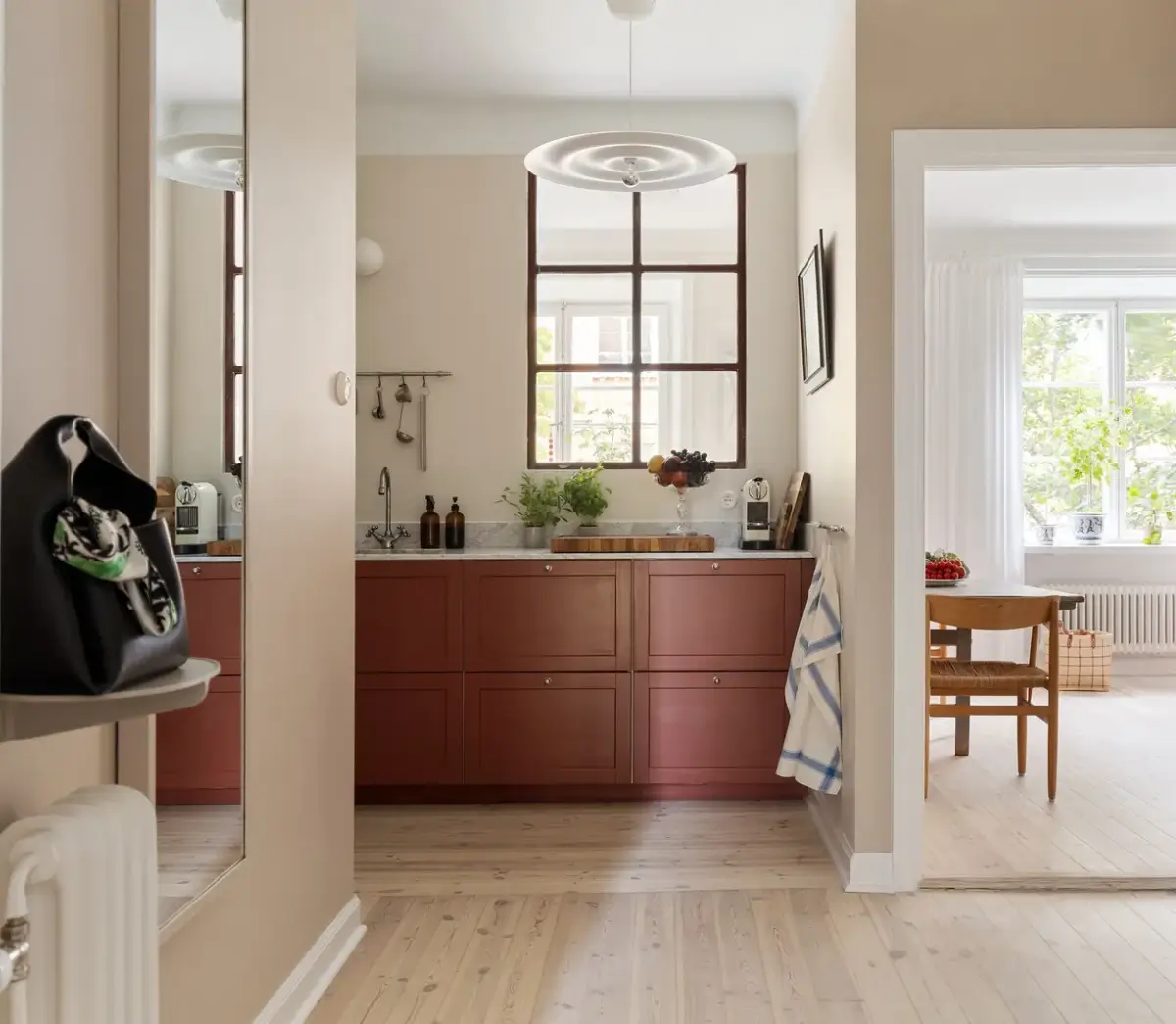 red kitchen small scandi apartmnt