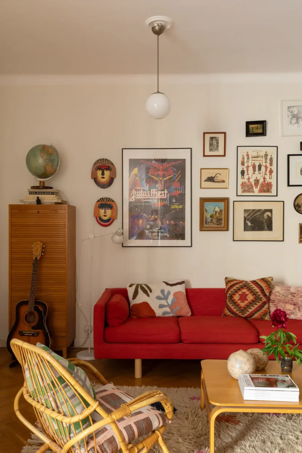 A Cozy 1920s Apartment Filled with Books, Art, and Music 4 red sofa