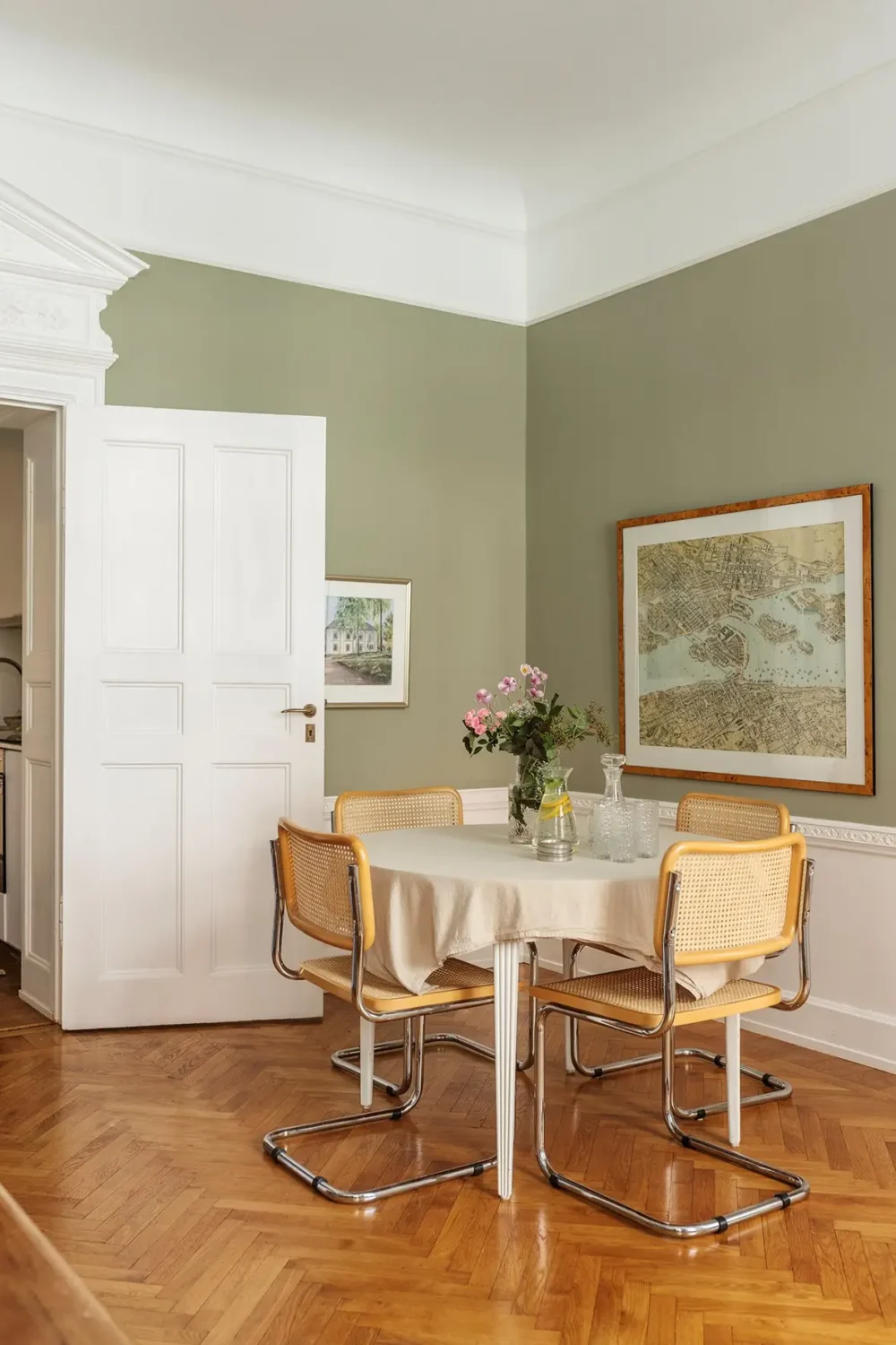 A Farrow & Ball Palette in an Art Nouveau Stockholm Apartment 4 round dining table sage green living room nordroom