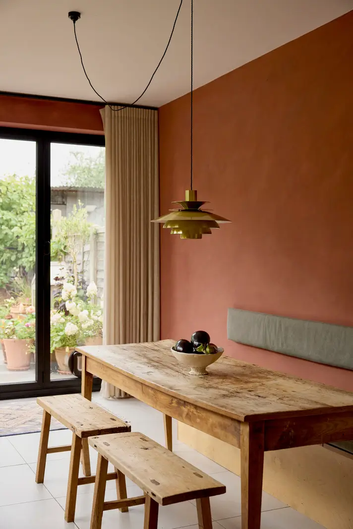 A Victorian Home with a Rich Color Palette and a Lush Garden 12 rustic table with bench