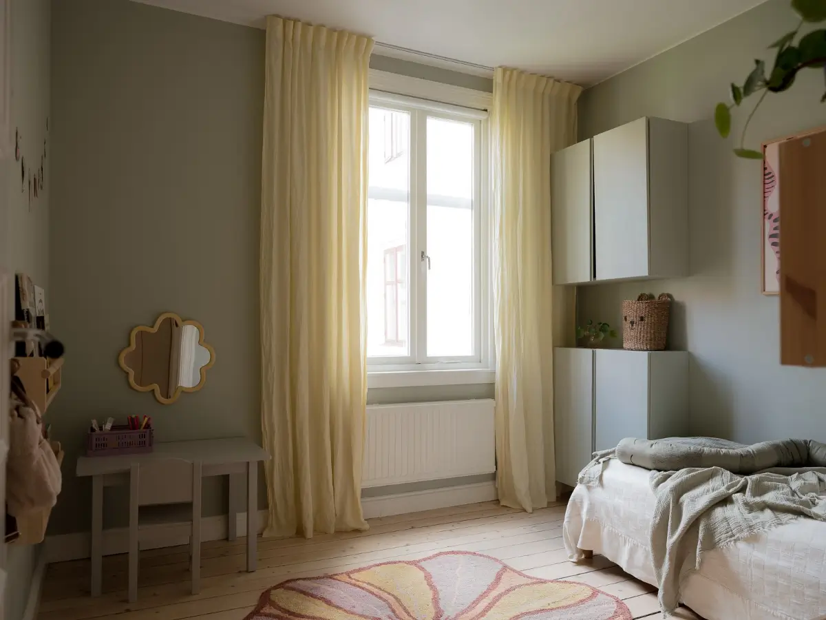 Neutral Shades and Period Elements in a Scandi Apartment 22 sage green kids bedroom yellow curtain