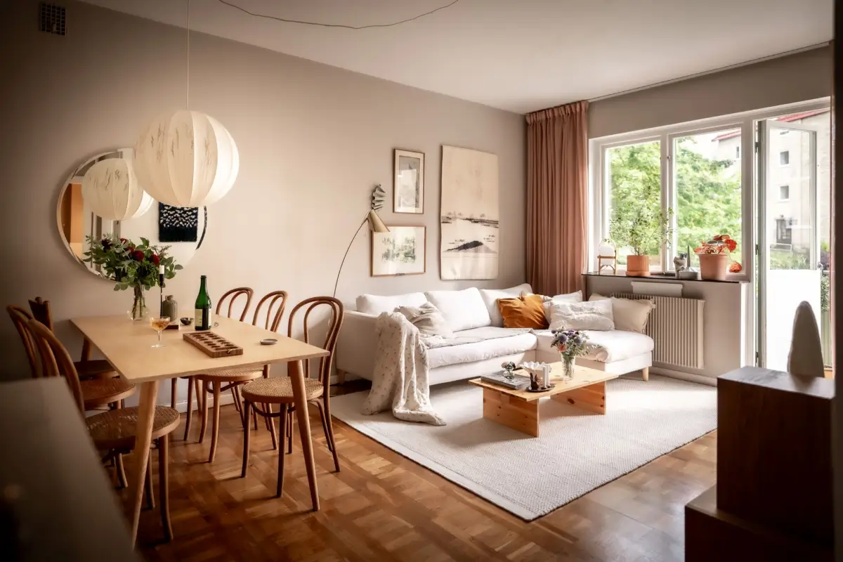 An Earthy Color Palette and Exposed Brick in a 1940s Apartment 1 scandinavian living room gray walls midcentury parquet floor