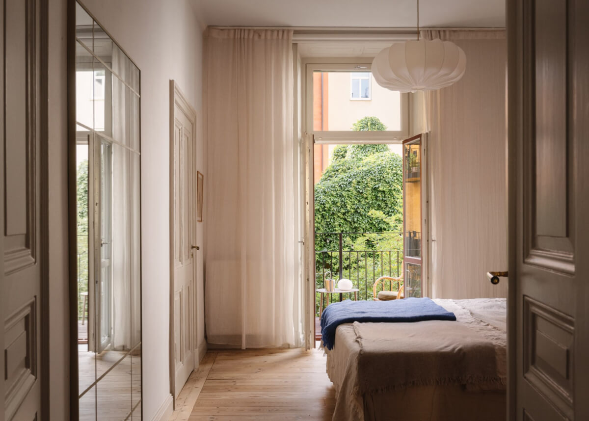 Blue and Red Color Accents in a Stylish Scandinavian Apartment 28 serene bedroom with balcony