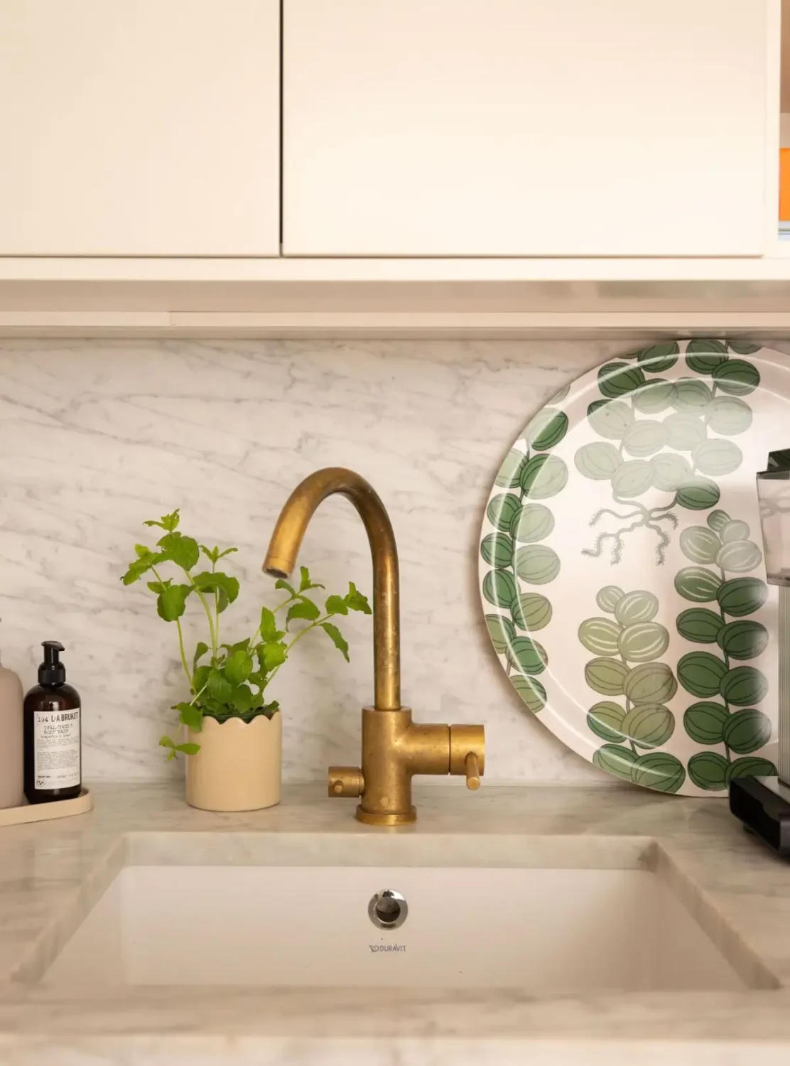 A Small Beige Stockholm Apartment with Plenty of Storage 12 sink detail