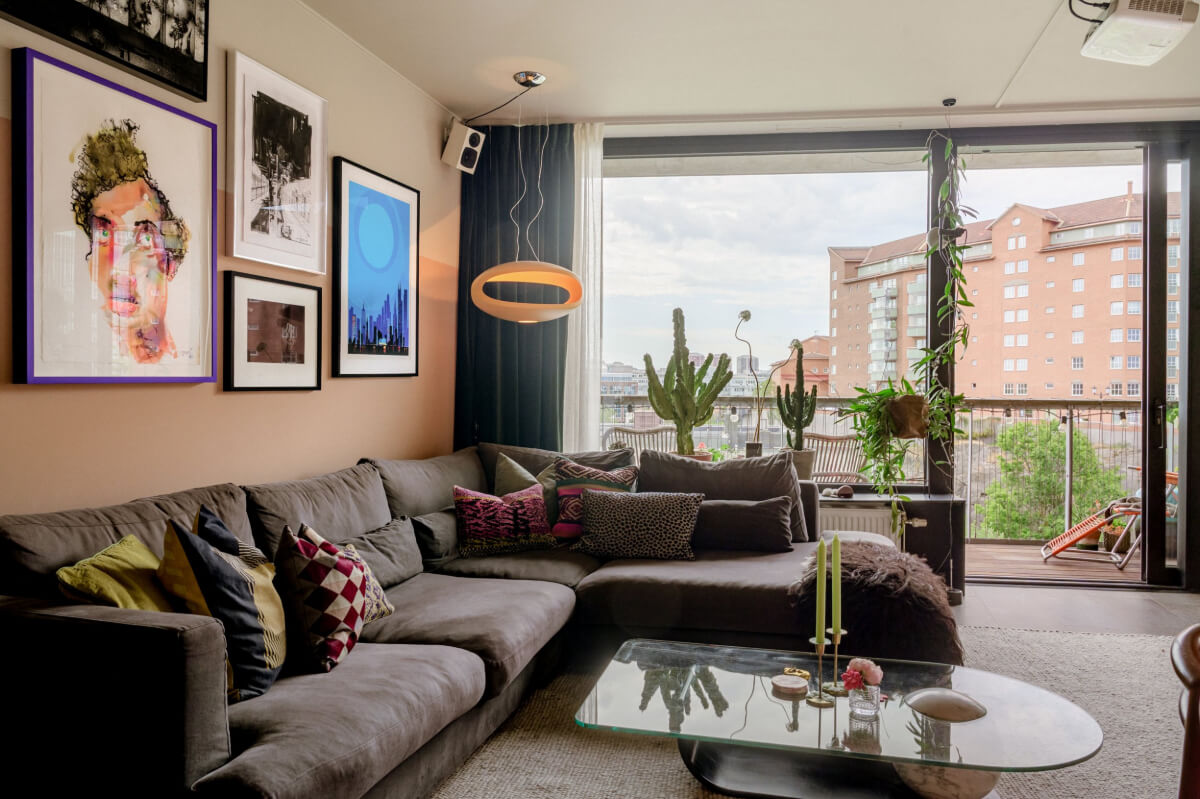 A Modern Swedish Apartment with Half-Painted Pink Walls 3 sitting room half painted pink walls