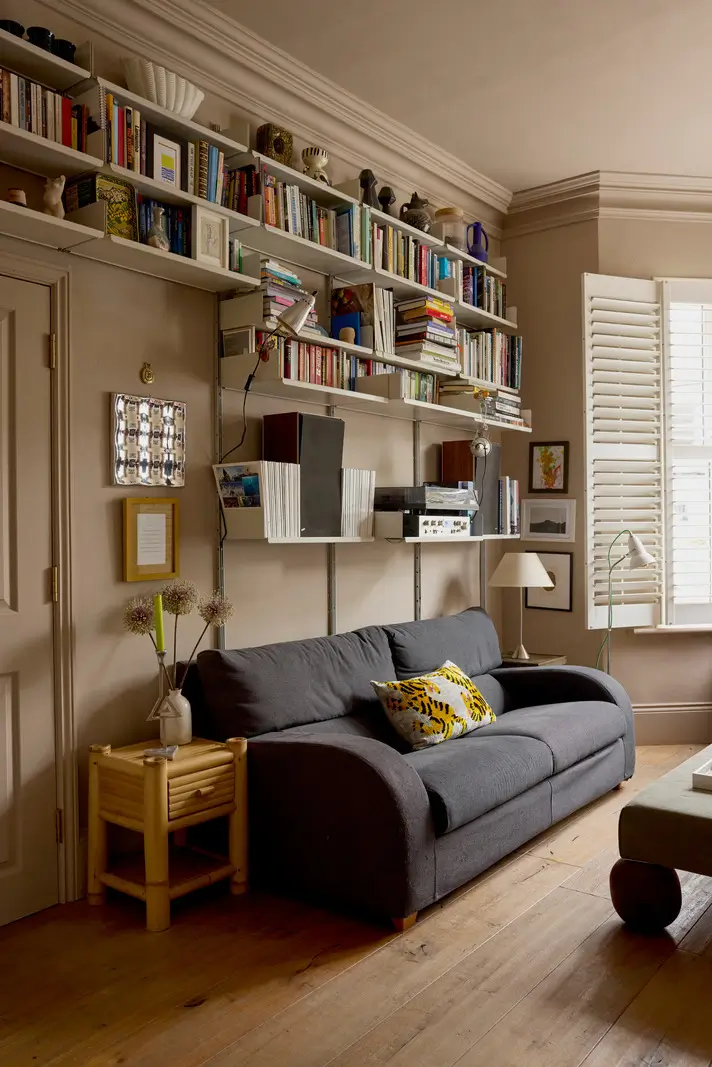 A Victorian Home with a Rich Color Palette and a Lush Garden 2 sitting room with bookshelves