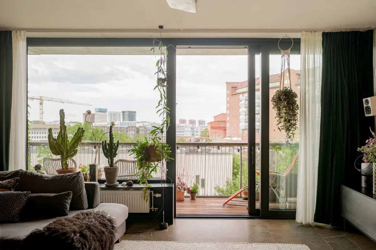 A Modern Swedish Apartment with Half-Painted Pink Walls 5 sliding doors to balcony