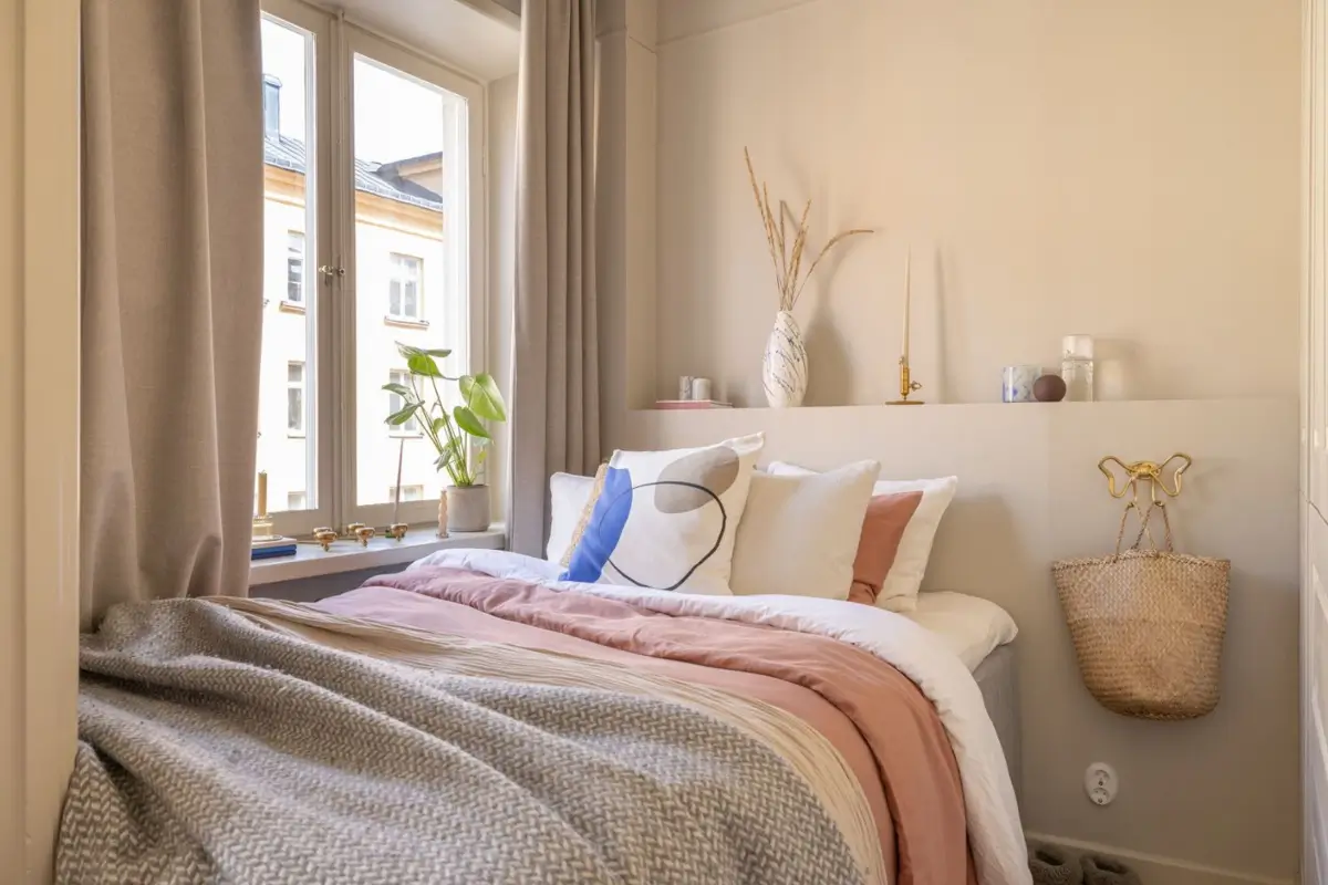 A Small Beige Stockholm Apartment with Plenty of Storage 17 small beige bedroom
