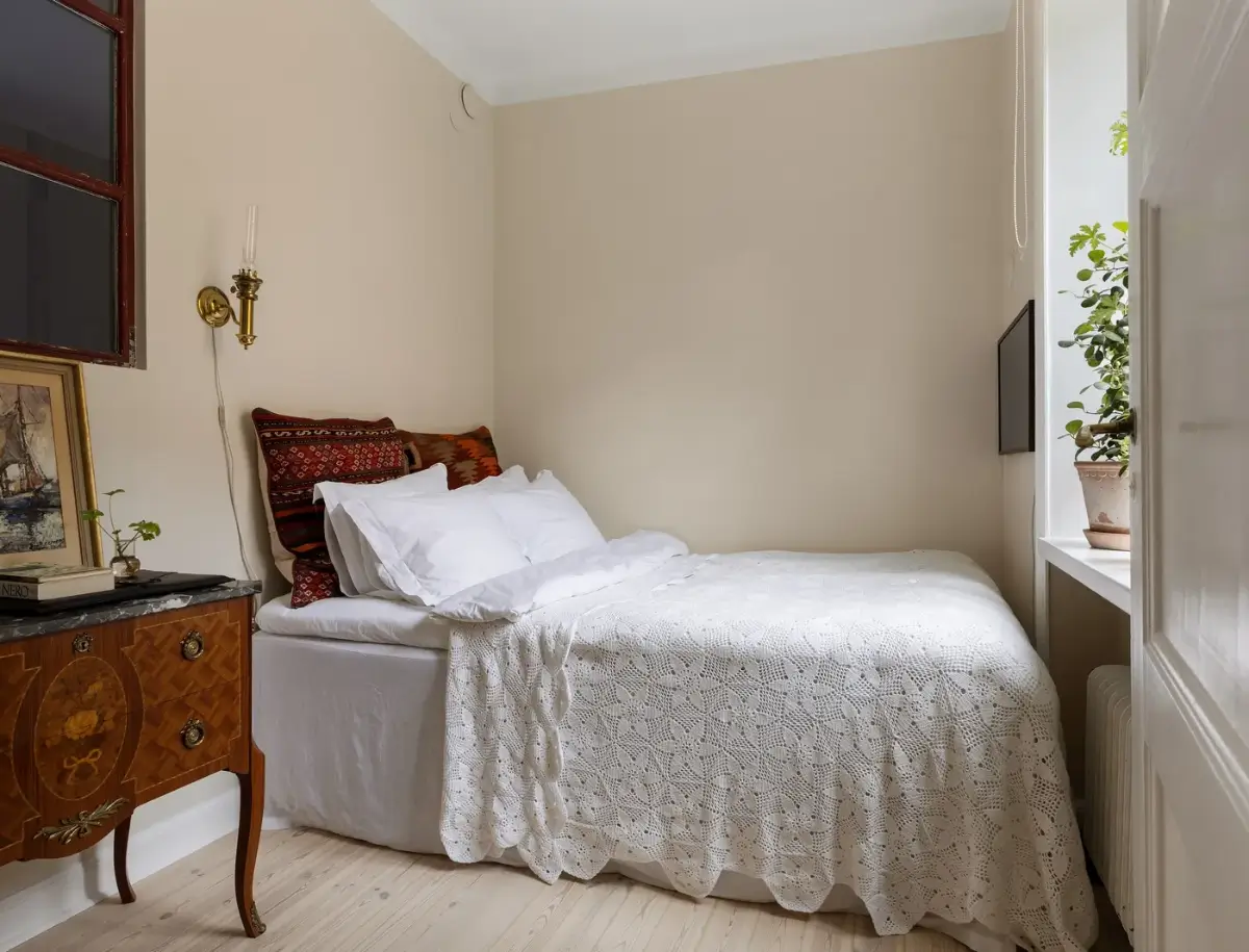 A Red Kitchen in a Small and Light Scandinavian Apartment 12 small-beige-bedroom