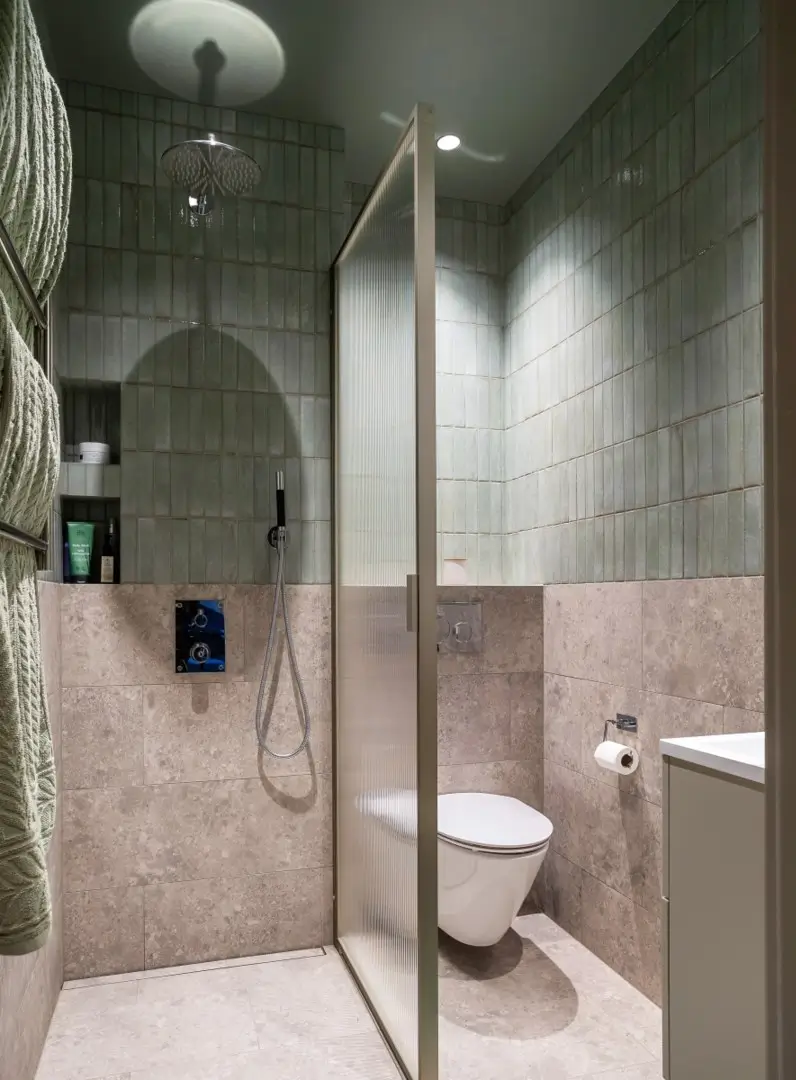 small hotel-style bathroom blue tiles