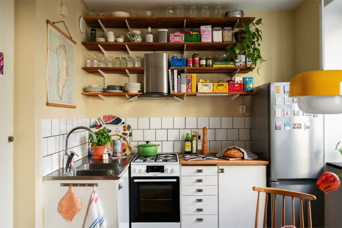 small kitchen butter-yellow walls wooden shelves nordroom