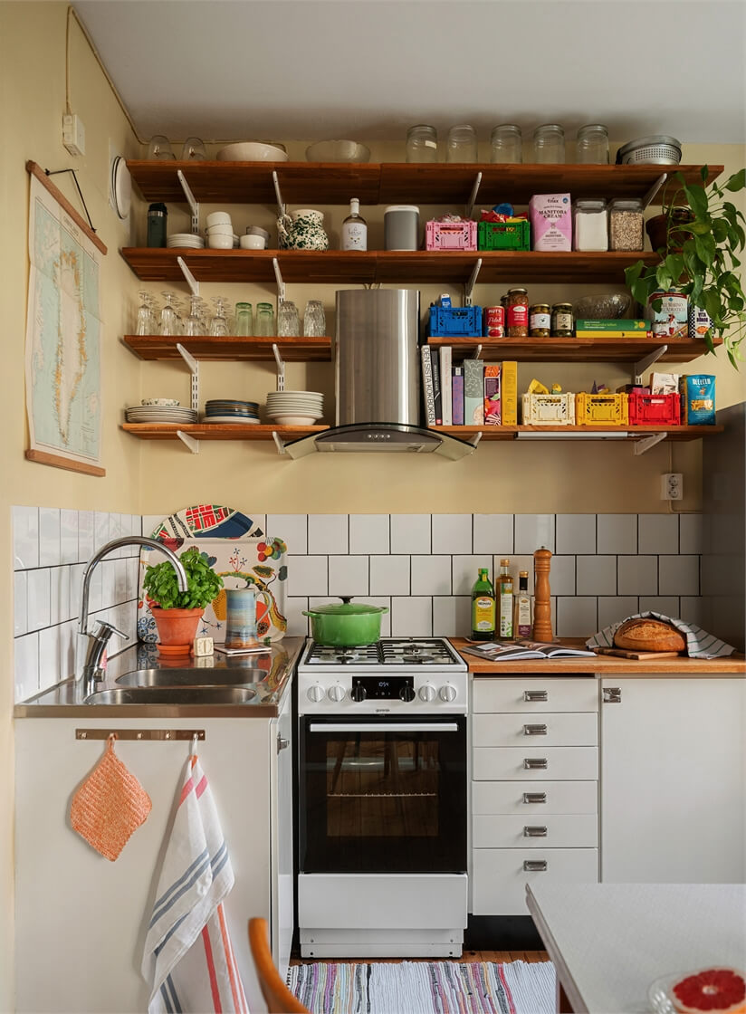 small midcentury kitchen wooden shelves butter-yellow walls nordroom
