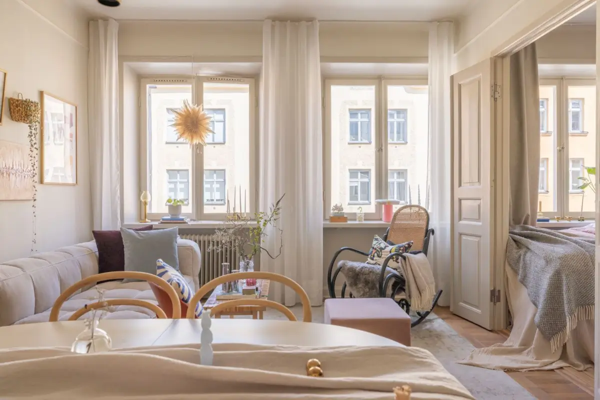 A Small Beige Stockholm Apartment with Plenty of Storage 2 small scandi living room large windows