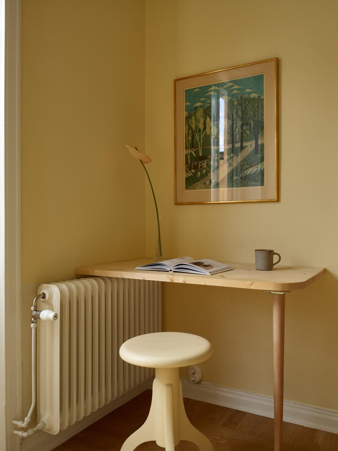 A Stockholm Apartment with a Butter-Yellow Bedroom 16 small simple wooden desk bedroom