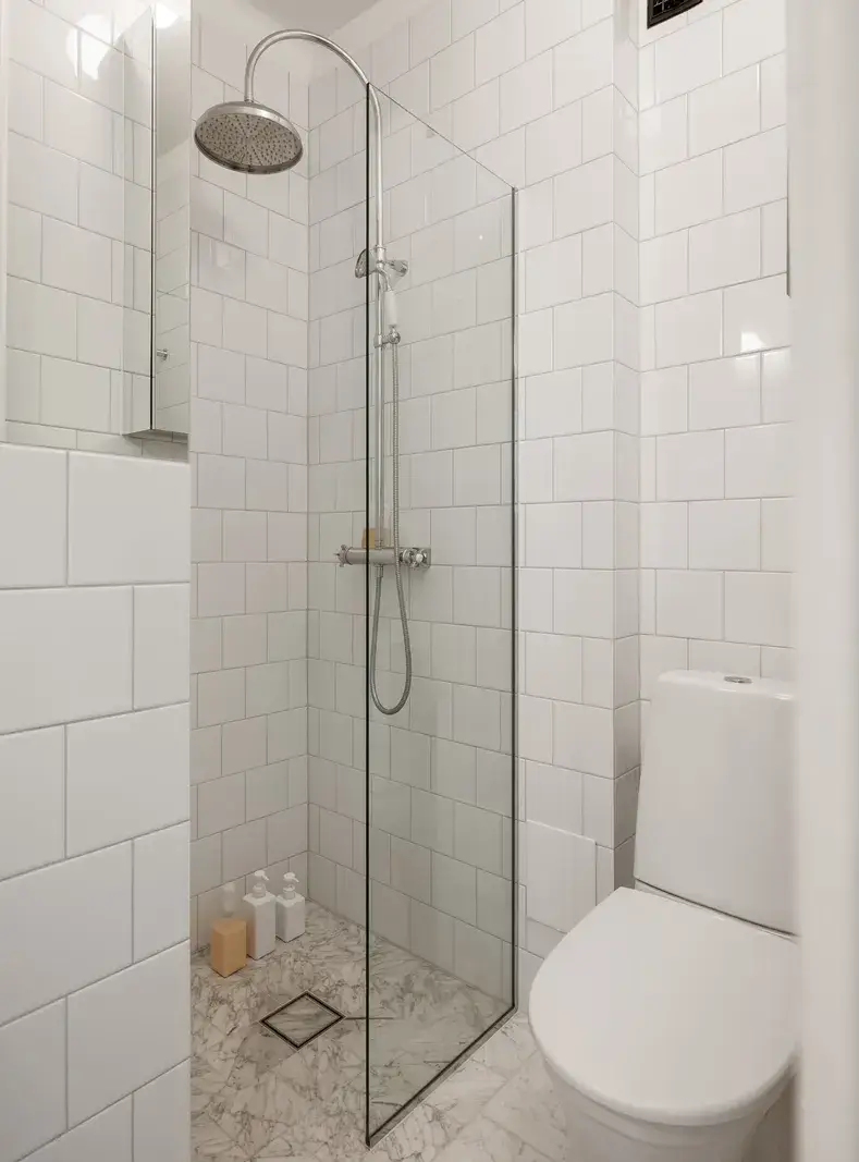 A Red Kitchen in a Small and Light Scandinavian Apartment 16 small white-tiled bathroom
