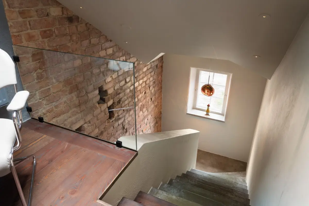 staircase exposed brick wall