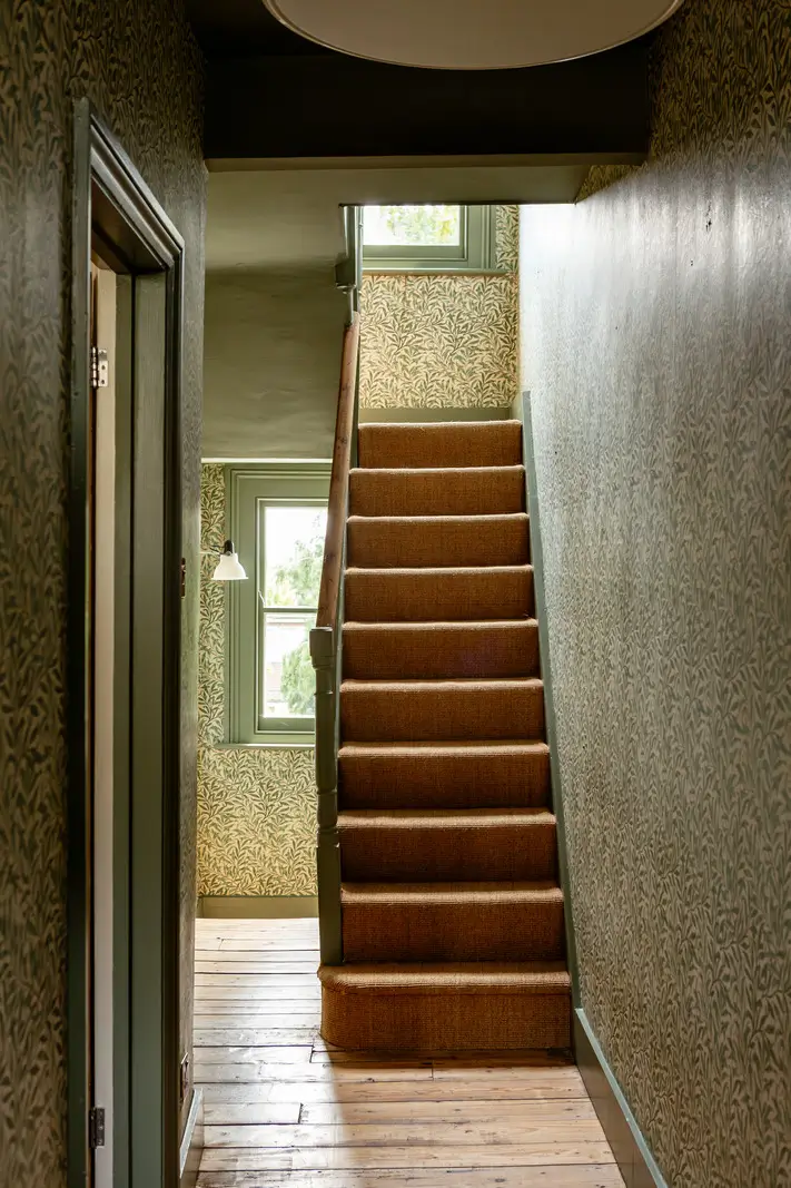 A Muted Color Palette and Original Details in a Victorian Terrace House 12 staircase william morris wallpaper A Muted Color Palette and Original Details in a Victorian Terrace House