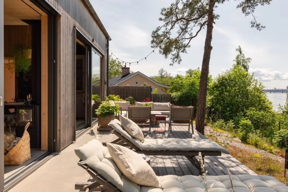 A Modern Wooden Cottage with Sea Views Close to Stockholm 31 terrace with lounge beds
