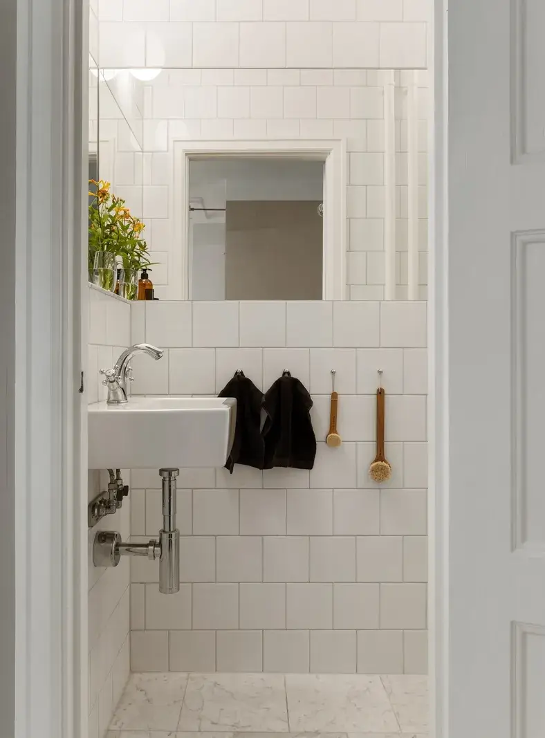 A Red Kitchen in a Small and Light Scandinavian Apartment 15 tiny bathroom