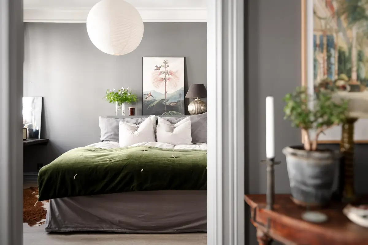 A Dark Gray Swedish Apartment with an Olive Green Kitchen 14 view into bedroom
