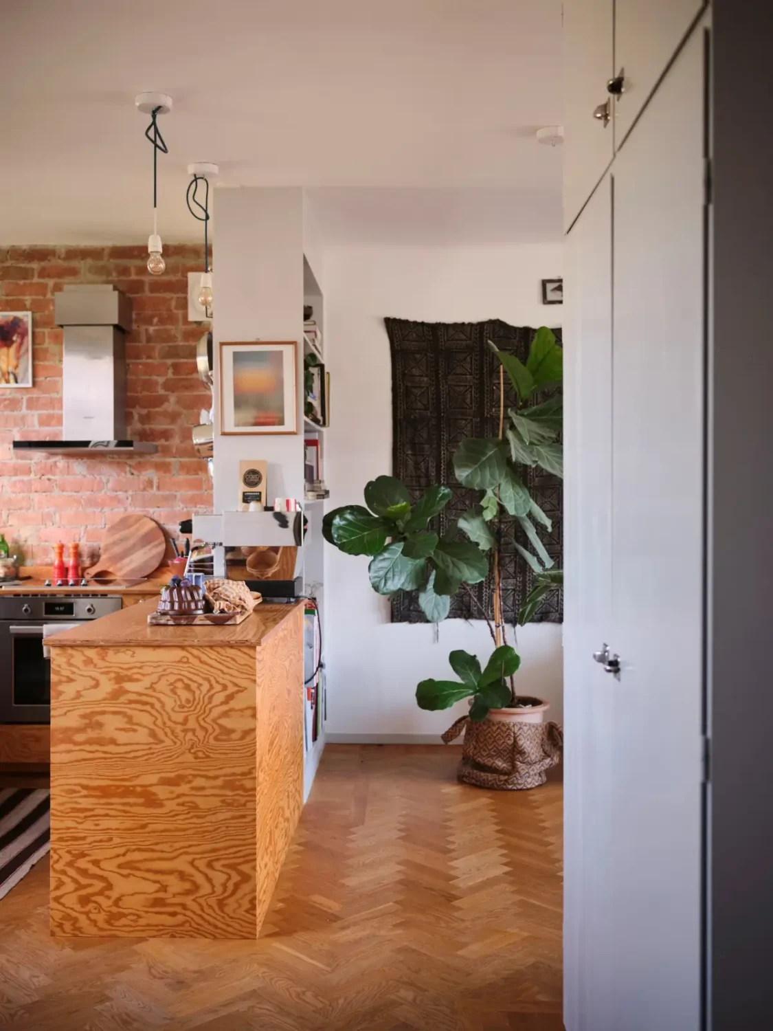 A Pink Bathroom and a Plywood Kitchen in a Stockholm Apartment 11 view into living space