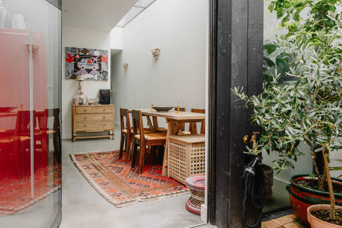 A Modern Ground-Floor Apartment with a Tiny Patio Garden 10 view into modern kitchen space concrete floor
