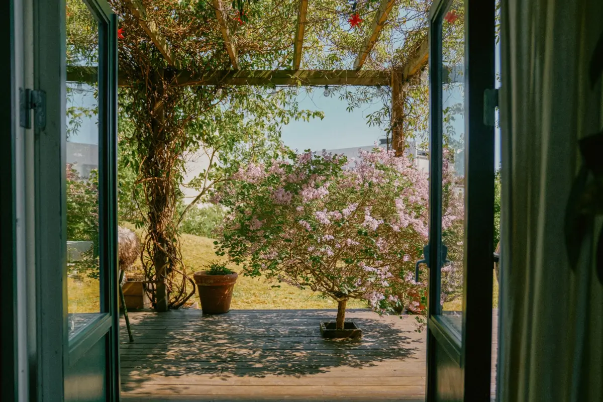 Industrial Elements in a 1960s Duplex Apartment in Stockholm 44 view onto garden terrace