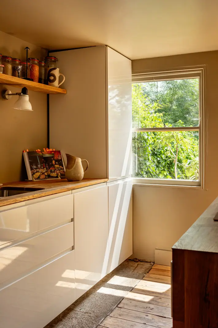A Muted Color Palette and Original Details in a Victorian Terrace House 2 white cabinets kitchen detail