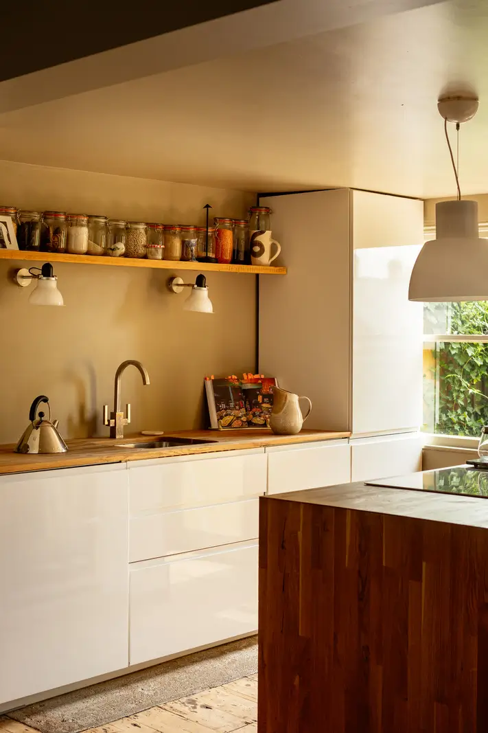 white kitchen cabinets wooden countertop display shelf
