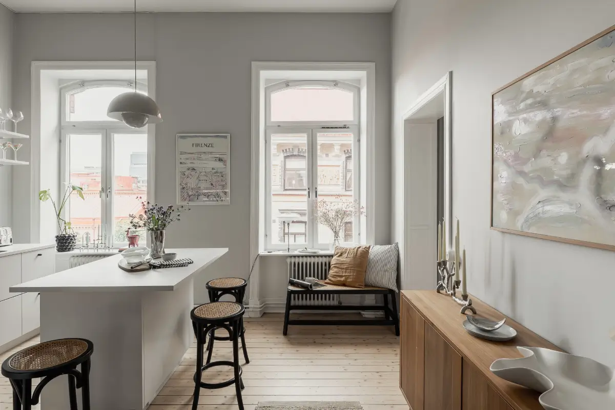 A Gray Scandinavian Apartment with a Royal History 13 white kitchen large windows wooden floor nordroom
