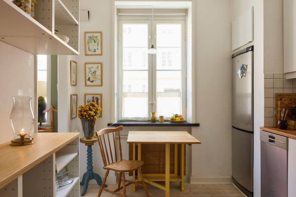 A Blue Living Room Filled with Art in a Swedish Apartment 12 white kitchen wooden folding table