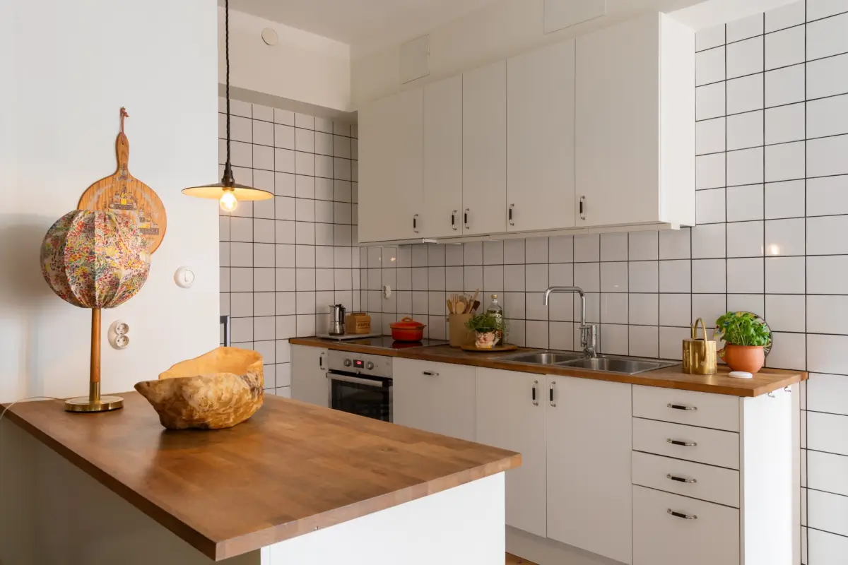 A Cozy 1920s Apartment Filled with Books, Art, and Music 9 white kitchen