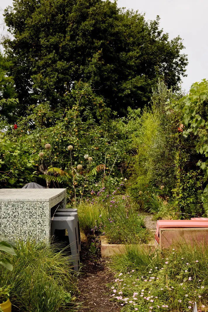 A Victorian Home with a Rich Color Palette and a Lush Garden 25 wild green garden table