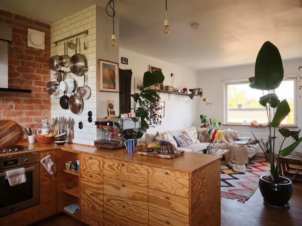 A Pink Bathroom and a Plywood Kitchen in a Stockholm Apartment 6 wood kitchen white tiles exposed brick