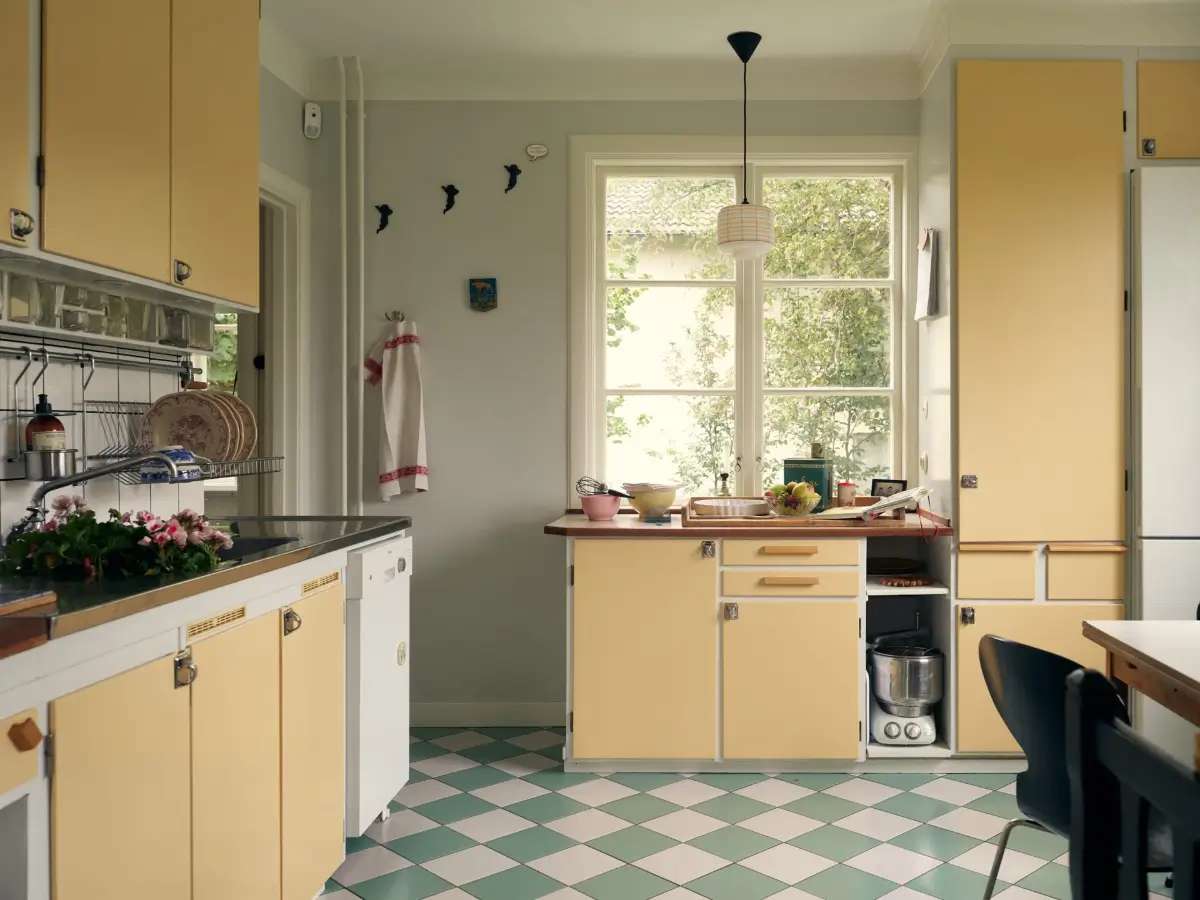 A Cheerful Color Palette in an Early 20th Century Villa in Stockholm 11 1950s kitchen yellow cabinets checkered floor nordroom