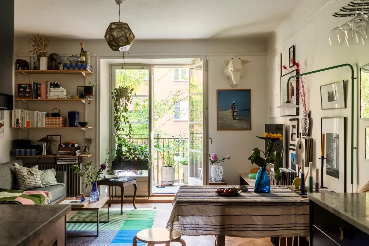A Charming Swedish Courtyard Apartment Filled with Art 2 art-filled living room colorful rug