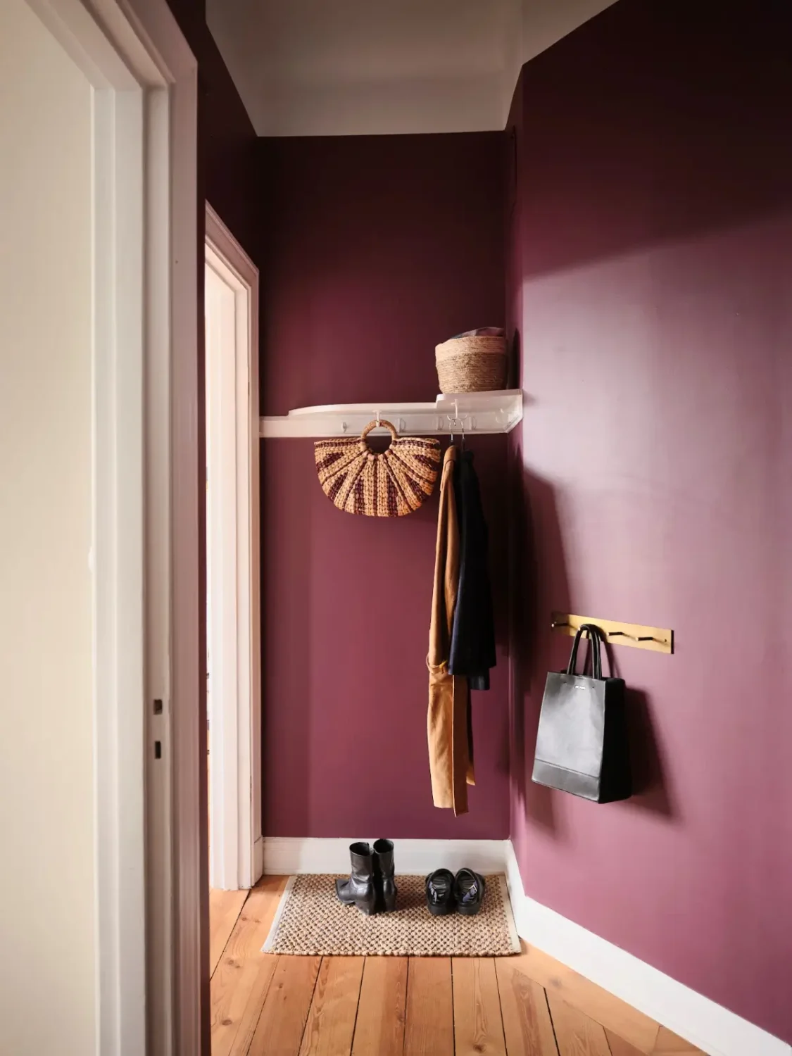 Warm Pink Walls and a Glass Room Divider in a Small Stockholm Apartment 27 auberigine color walls hallway
