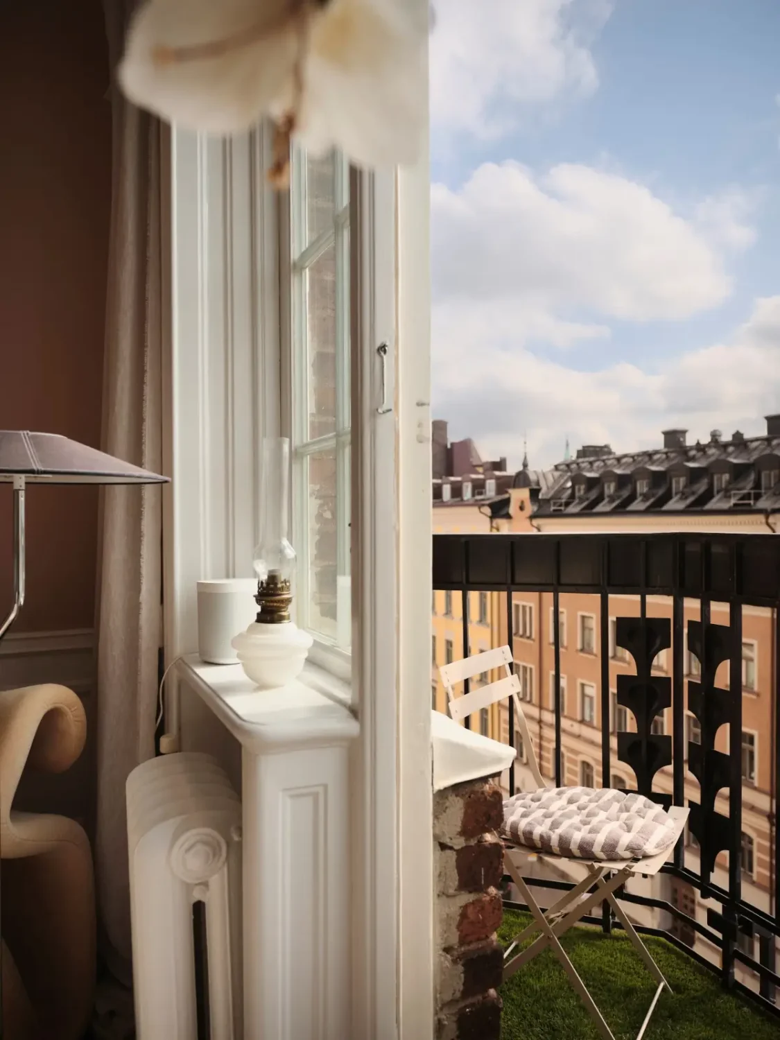Warm Pink Walls and a Glass Room Divider in a Small Stockholm Apartment 13 balcony