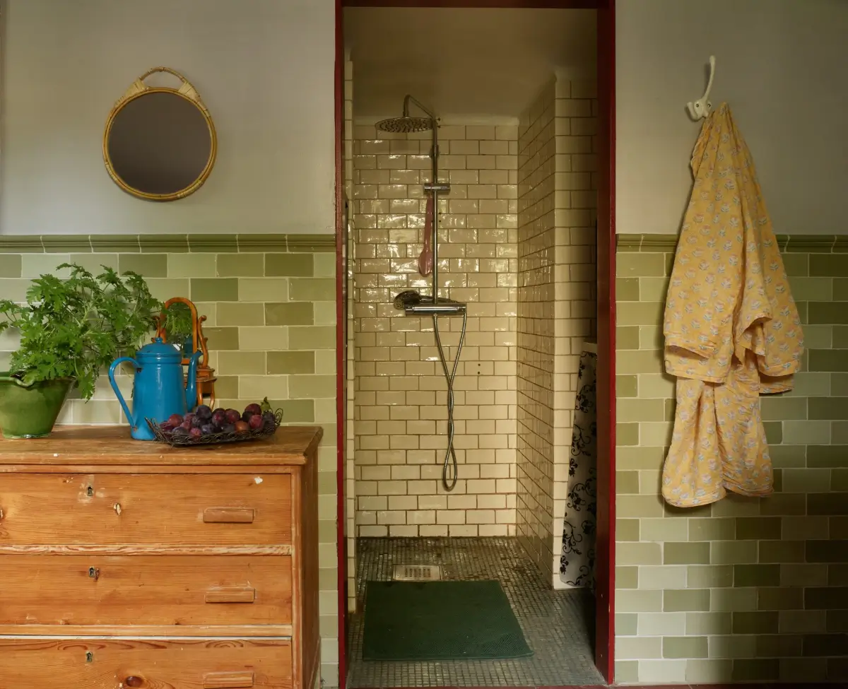 A Well-Preserved 1920s House with a Green Kitchen in Stockholm 27 basement bathroom green tiles